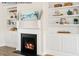 Cozy living room featuring a fireplace, custom built-in bookshelves and white trim at 4013 Kingcraig Ln, Zebulon, NC 27597