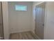 Bright mudroom featuring a small window and a durable, attractive wood-look floor at 4013 Kingcraig Ln, Zebulon, NC 27597