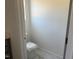 A close-up view shows a standard white toilet in a small area with marble floors at 4013 Kingcraig Ln, Zebulon, NC 27597