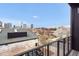 Stunning balcony view overlooking a vibrant city skyline and charming residential neighborhood at 402 Chavis Way, Raleigh, NC 27601