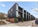 Contemporary townhouse exteriors featuring clean lines, balconies, and modern design at 402 Chavis Way, Raleigh, NC 27601