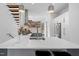 Bright kitchen featuring a spacious island, modern appliances, open shelving, and stylish pendant lighting at 402 Chavis Way, Raleigh, NC 27601