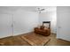 Bright living room featuring a comfortable couch, rug, and modern ceiling fan at 402 Chavis Way, Raleigh, NC 27601