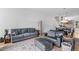 Cozy living room with hardwood floors, comfortable seating, and a stylish rug creating a welcoming atmosphere at 402 Chavis Way, Raleigh, NC 27601