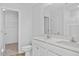 Bright bathroom featuring double sinks with quartz countertops and white cabinets at 41 Alderman Ct # 2, Dunn, NC 28334