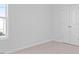 Bedroom features neutral carpet, window, and a closet with double doors at 41 Alderman Ct # 2, Dunn, NC 28334