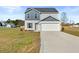 Charming two-story home with a two-car garage and neutral-toned siding at 41 Alderman Ct # 2, Dunn, NC 28334