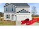 Charming two-story home with a two-car garage and neutral-toned siding at 41 Alderman Ct # 2, Dunn, NC 28334