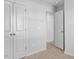 Neutral carpeted hallway features white doors at 41 Alderman Ct # 2, Dunn, NC 28334