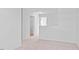 Hallway features neutral carpet, white trim, and white doors leading to rooms at 41 Alderman Ct # 2, Dunn, NC 28334