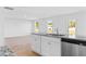 Bright kitchen boasts granite countertops, stainless steel appliances, and seamless flow to living area at 41 Alderman Ct # 2, Dunn, NC 28334