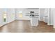 Open kitchen with white cabinets, granite countertops and stainless-steel appliances at 41 Alderman Ct # 2, Dunn, NC 28334