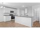 Modern kitchen with white cabinets, granite countertops, and a center island at 41 Alderman Ct # 2, Dunn, NC 28334