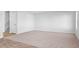 Expansive living room featuring neutral walls, carpeted flooring, ample natural light, and staircase at 41 Alderman Ct # 2, Dunn, NC 28334