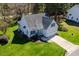 Aerial view of a charming home featuring a well-maintained lawn and an attached two-car garage at 4108 4108 Gallatree Ln, Raleigh, NC 27616
