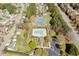 Aerial view of community pool, tennis courts, and surrounding neighborhood with mature trees at 4108 4108 Gallatree Ln, Raleigh, NC 27616