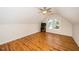 Empty bonus room with dormer ceiling, ceiling fan, and two windows at 4108 4108 Gallatree Ln, Raleigh, NC 27616
