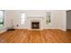 Bright living room boasts hardwood floors, a cozy fireplace, and sun-filled windows at 4108 4108 Gallatree Ln, Raleigh, NC 27616