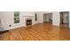 Warm and inviting living room with hardwood floors, fireplace, and plenty of natural light at 4108 4108 Gallatree Ln, Raleigh, NC 27616