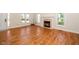 Open living room with hardwood floors, natural light and a fireplace at 4108 4108 Gallatree Ln, Raleigh, NC 27616