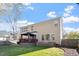 Well-maintained backyard with a gazebo-covered deck, mature trees, and a defined grassy area at 4619 Paces Ferry Dr, Durham, NC 27712