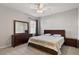 Comfortable bedroom with neutral tones, a ceiling fan, and ample closet space at 4619 Paces Ferry Dr, Durham, NC 27712