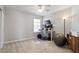 Versatile bedroom with ample space, a desk setup, and natural light, ideal for a home office at 4619 Paces Ferry Dr, Durham, NC 27712