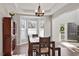 Bright dining room featuring a bay window, wood floors, and a classic chandelier at 4619 Paces Ferry Dr, Durham, NC 27712