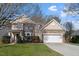Traditional two-story home with brick and siding exterior and an attached two-car garage at 4619 Paces Ferry Dr, Durham, NC 27712