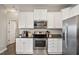 Efficient kitchen with stainless steel appliances and granite countertops at 4619 Paces Ferry Dr, Durham, NC 27712