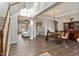 Bright and airy living room with hardwood floors, large windows, and a cozy seating area at 4619 Paces Ferry Dr, Durham, NC 27712