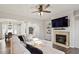 Open-concept living area with fireplace, built-ins, and dining room views at 4619 Paces Ferry Dr, Durham, NC 27712