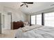 Serene main bedroom with natural light, a dresser, and a cozy chair creating a relaxing retreat at 4619 Paces Ferry Dr, Durham, NC 27712