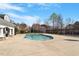 Community pool with a large deck area and view of neighboring homes at 4619 Paces Ferry Dr, Durham, NC 27712