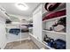 The primary closet features custom shelving and storage for organization at 4633 Edwards Mill Rd, Raleigh, NC 27612