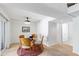 Cozy dining area features a glass-top table and modern lighting, perfect for Gathering meals at 4633 Edwards Mill Rd, Raleigh, NC 27612