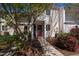 Charming exterior featuring a well-maintained facade, inviting entryway, and lush landscaping at 4633 Edwards Mill Rd, Raleigh, NC 27612