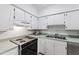 Functional kitchen with white cabinets and essential appliances at 4633 Edwards Mill Rd, Raleigh, NC 27612