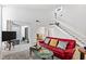 Bright living room boasting vaulted ceilings, open staircase, and access to outdoor space at 4633 Edwards Mill Rd, Raleigh, NC 27612