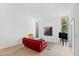 Bright living room with high ceilings, tile floors, and modern furnishings by large windows at 4633 Edwards Mill Rd, Raleigh, NC 27612
