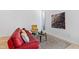 Comfortable living room featuring modern art, stylish furniture, and natural light from tall windows at 4633 Edwards Mill Rd, Raleigh, NC 27612