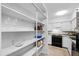 A view into the pantry shows ample shelving for storage of food and drink items at 4633 Edwards Mill Rd, Raleigh, NC 27612