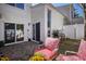 Back patio featuring outdoor furniture, stone flooring and a BBQ grill at 4633 Edwards Mill Rd, Raleigh, NC 27612