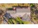 Aerial of the home showing the roof and wooded backyard at 501 Hiddenbrook Dr, Durham, NC 27703