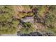 Peaceful aerial view of wooded home with mature trees for shade and privacy at 501 Hiddenbrook Dr, Durham, NC 27703