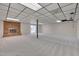 Large basement featuring a brick fireplace, carpet flooring and sliding doors to the backyard at 501 Hiddenbrook Dr, Durham, NC 27703