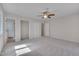 Spacious bedroom with ceiling fan and carpeted floor, offering lots of light at 501 Hiddenbrook Dr, Durham, NC 27703