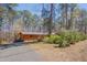 Exterior view of the home with driveway and mature trees at 501 Hiddenbrook Dr, Durham, NC 27703