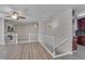 Open-concept living room showcases hardwood floors and a staircase leading down to the lower level at 501 Hiddenbrook Dr, Durham, NC 27703