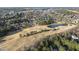 An aerial view of a residential community, showcasing a golf course and surrounding natural landscape at 512 Hallburg Ct, Wake Forest, NC 27587